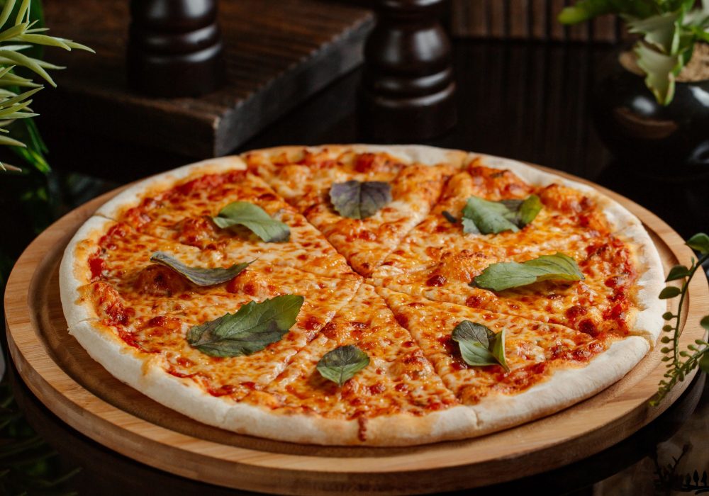 margharita-pizza-with-full-tomato-sauce-andgreen-basilica-leaves-per-slice